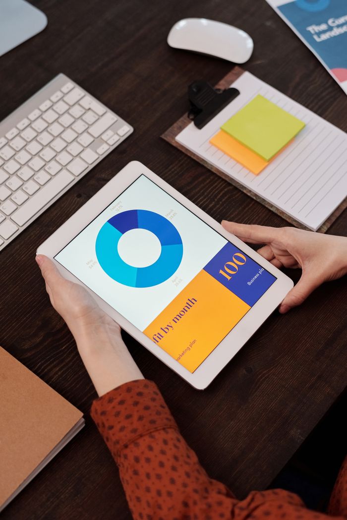 vision Modern office setting featuring a digital tablet displaying a graph, perfect for business presentations.